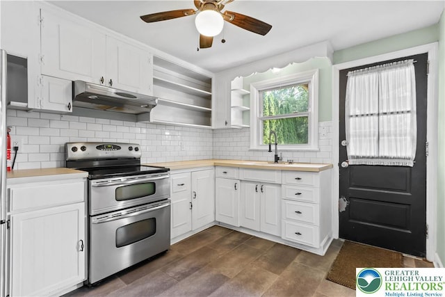 1882 Ridgelawn Ave, Bethlehem City, PA 18018 - kitchen with double oven range, under cabinet range hood, a ceiling fan, white cabinets, and tasteful backsplash
