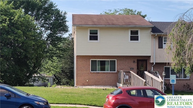 5278 Herman St, Heidelberg Twp, PA 18053 - view of front of property featuring brick siding and a front lawn