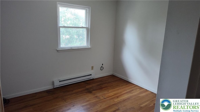 5278 Herman St, Heidelberg Twp, PA 18053 - unfurnished room featuring baseboard heating and wood finished floors