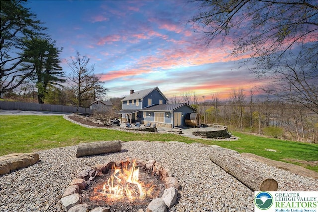 3224 Middle Easton Belmont Pike, Hamilton Twp, PA 18360 - rear view of house with an outdoor fire pit and a metal roof