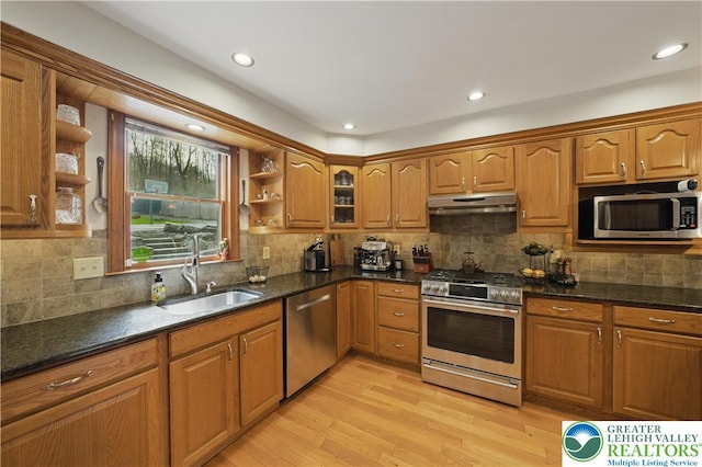 3224 Middle Easton Belmont Pike, Hamilton Twp, PA 18360 - kitchen featuring stainless steel appliances, under cabinet range hood, open shelves, brown cabinets, and light wood-type flooring