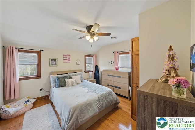3224 Middle Easton Belmont Pike, Hamilton Twp, PA 18360 - bedroom with multiple windows, light wood-style flooring, vaulted ceiling, and ceiling fan