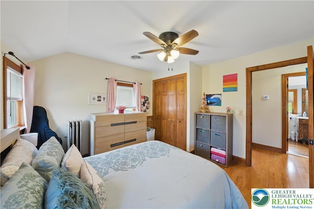 3224 Middle Easton Belmont Pike, Hamilton Twp, PA 18360 - bedroom with radiator heating unit, light wood-style flooring, a closet, ceiling fan, and lofted ceiling