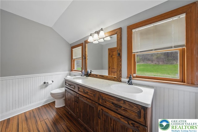 3224 Middle Easton Belmont Pike, Hamilton Twp, PA 18360 - full bath with wainscoting, hardwood / wood-style floors, vaulted ceiling, and double vanity