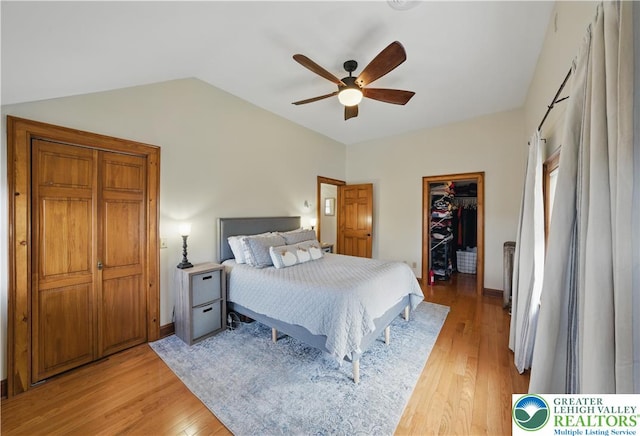 3224 Middle Easton Belmont Pike, Hamilton Twp, PA 18360 - bedroom featuring light wood-style floors, vaulted ceiling, a walk in closet, a ceiling fan, and a closet