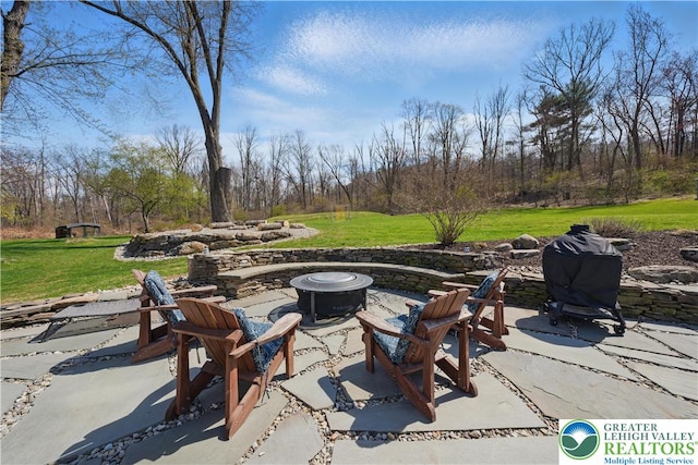 3224 Middle Easton Belmont Pike, Hamilton Twp, PA 18360 - view of patio / terrace with an outdoor fire pit and view of wooded area