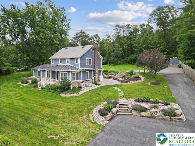 3224 Middle Easton Belmont Pike, Hamilton Twp, PA 18360 - view of front of property with stone siding, a chimney, a porch, and a front yard