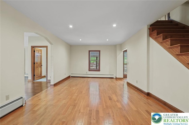 3224 Middle Easton Belmont Pike, Hamilton Twp, PA 18360 - unfurnished living room featuring baseboard heating, arched walkways, light wood finished floors, a baseboard heating unit, and recessed lighting
