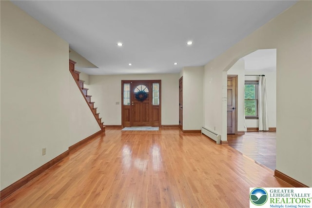 3224 Middle Easton Belmont Pike, Hamilton Twp, PA 18360 - entrance foyer with a baseboard radiator, arched walkways, plenty of natural light, light wood-style flooring, and recessed lighting