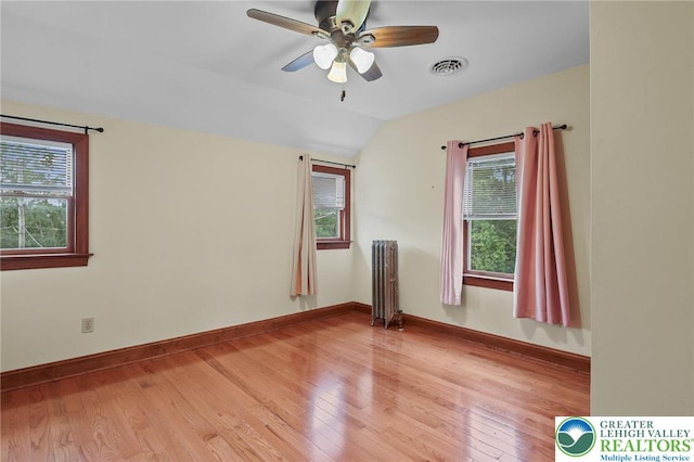 3224 Middle Easton Belmont Pike, Hamilton Twp, PA 18360 - empty room with radiator, light wood-type flooring, vaulted ceiling, and ceiling fan
