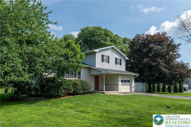 4834 Maple St, Lower Mt Bethel Twp, PA 18013 - view of front of home featuring an attached garage, asphalt driveway, a front yard, and brick siding