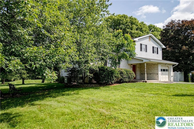 4834 Maple St, Lower Mt Bethel Twp, PA 18013 - view of front of house featuring a front lawn, an attached garage, and brick siding