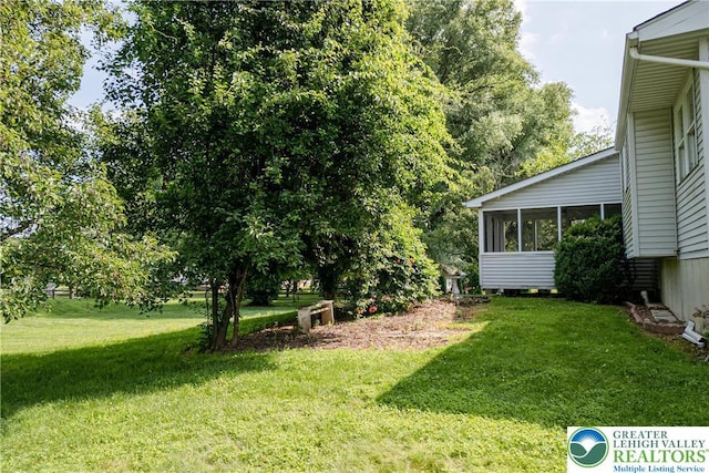4834 Maple St, Lower Mt Bethel Twp, PA 18013 - view of grassy yard featuring a sunroom