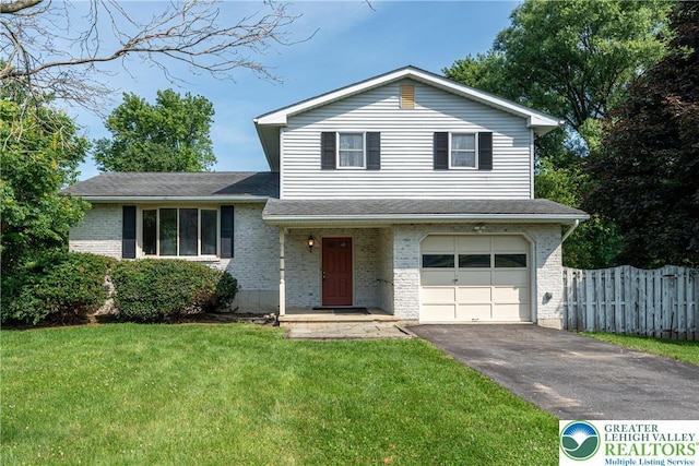 4834 Maple St, Lower Mt Bethel Twp, PA 18013 - tri-level home featuring asphalt driveway, a garage, brick siding, and a shingled roof