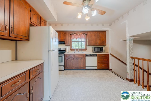 4834 Maple St, Lower Mt Bethel Twp, PA 18013 - kitchen with stainless steel appliances, a ceiling fan, brown cabinets, and light countertops