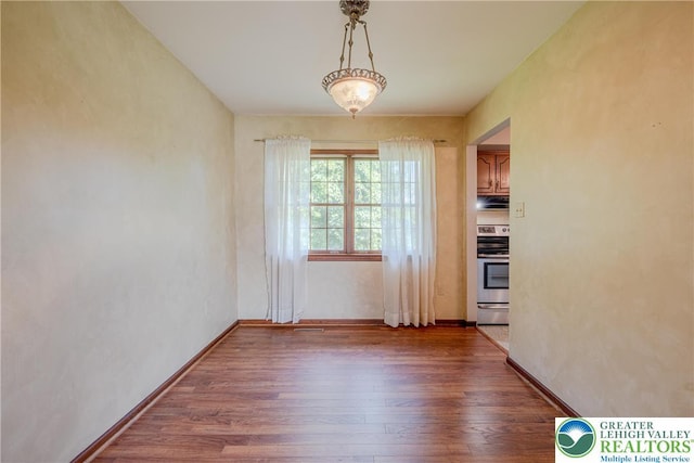4834 Maple St, Lower Mt Bethel Twp, PA 18013 - unfurnished dining area with wood finished floors and baseboards