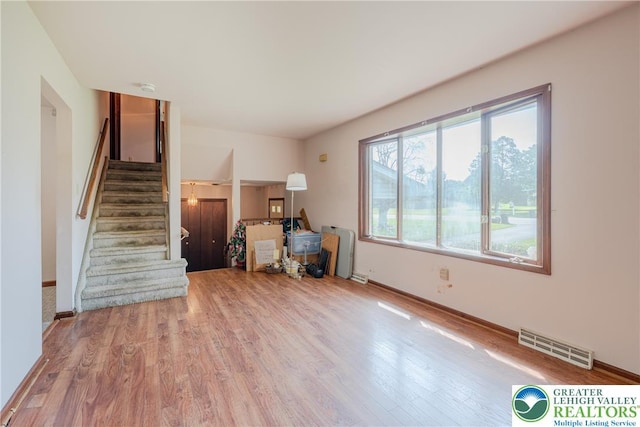 4834 Maple St, Lower Mt Bethel Twp, PA 18013 - unfurnished living room with stairs and wood finished floors