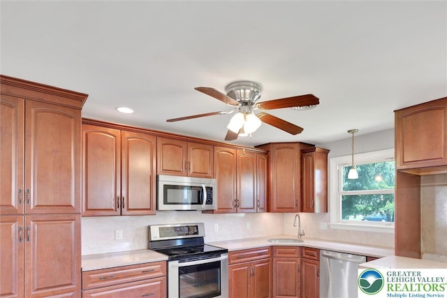 217 2nd St, Walnutport Boro, PA 18088 - kitchen with appliances with stainless steel finishes, light countertops, backsplash, pendant lighting, and recessed lighting