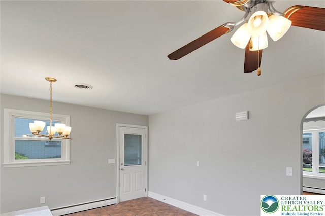 217 2nd St, Walnutport Boro, PA 18088 - spare room with baseboard heating, a chandelier, and arched walkways