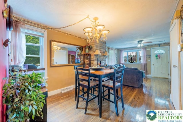 801 Karoly St, Freemansburg Boro, PA 18017 - dining room featuring wood finished floors, a chandelier, and plenty of natural light