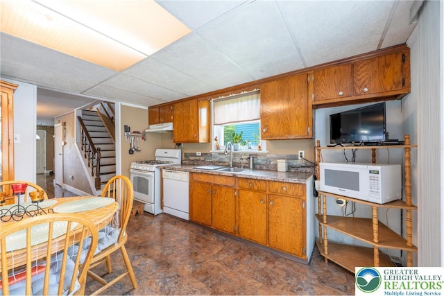 801 Karoly St, Freemansburg Boro, PA 18017 - kitchen featuring white appliances, under cabinet range hood, and brown cabinets