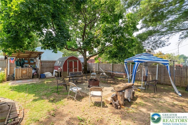 801 Karoly St, Freemansburg Boro, PA 18017 - fenced backyard featuring a storage shed, an outdoor fire pit, and a pergola