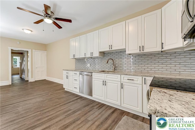1744 W Chew St, Allentown City, PA 18104 - kitchen with stainless steel appliances, light wood-style flooring, ceiling fan, backsplash, and white cabinets