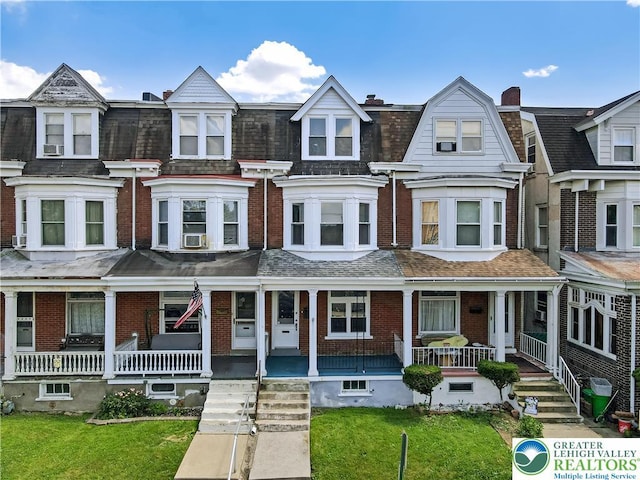 1744 W Chew St, Allentown City, PA 18104 - view of property with covered porch, brick siding, and a front yard
