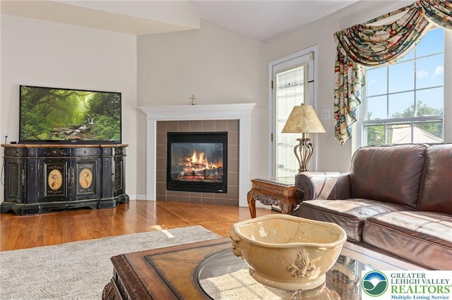 441 Sawgrass Dr, Upper Macungie Twp, PA 18104 - living room with a tile fireplace and wood finished floors