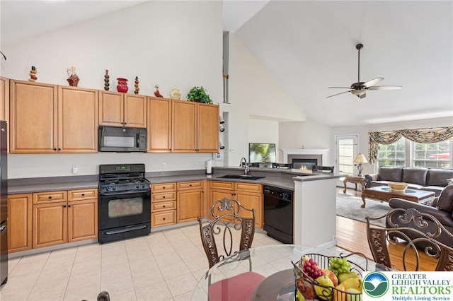 441 Sawgrass Dr, Upper Macungie Twp, PA 18104 - kitchen with black appliances, high vaulted ceiling, a peninsula, open floor plan, and ceiling fan