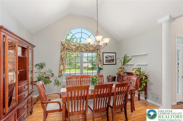 441 Sawgrass Dr, Upper Macungie Twp, PA 18104 - dining area featuring light wood-style floors, vaulted ceiling, a chandelier, and ornate columns