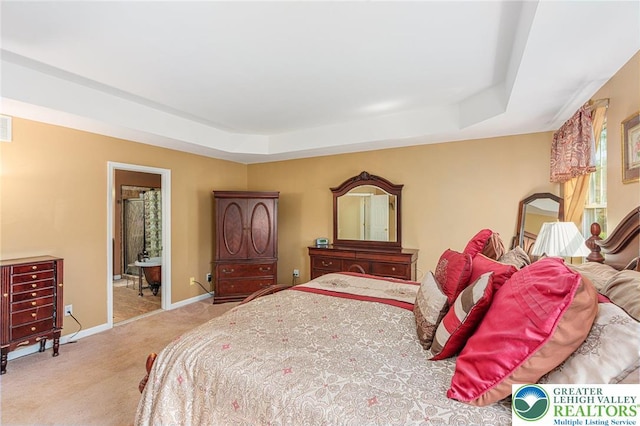 441 Sawgrass Dr, Upper Macungie Twp, PA 18104 - bedroom with a tray ceiling, carpet floors, and ensuite bathroom