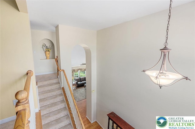 441 Sawgrass Dr, Upper Macungie Twp, PA 18104 - staircase featuring arched walkways and wood finished floors