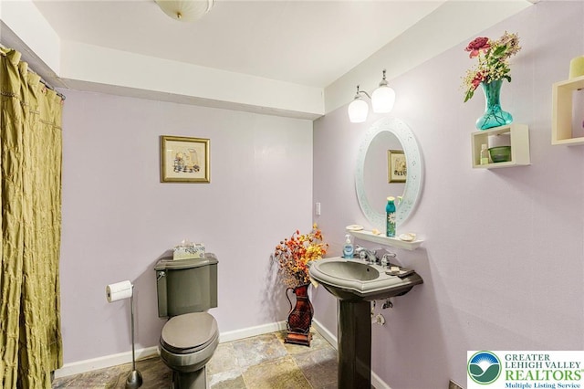 441 Sawgrass Dr, Upper Macungie Twp, PA 18104 - full bathroom with baseboards and stone finish floors