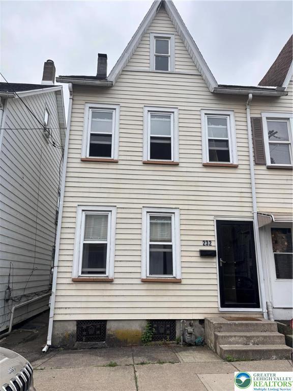 232 W Nesquehoning St, Easton, PA 18042 - view of front of property featuring entry steps, a chimney, and crawl space