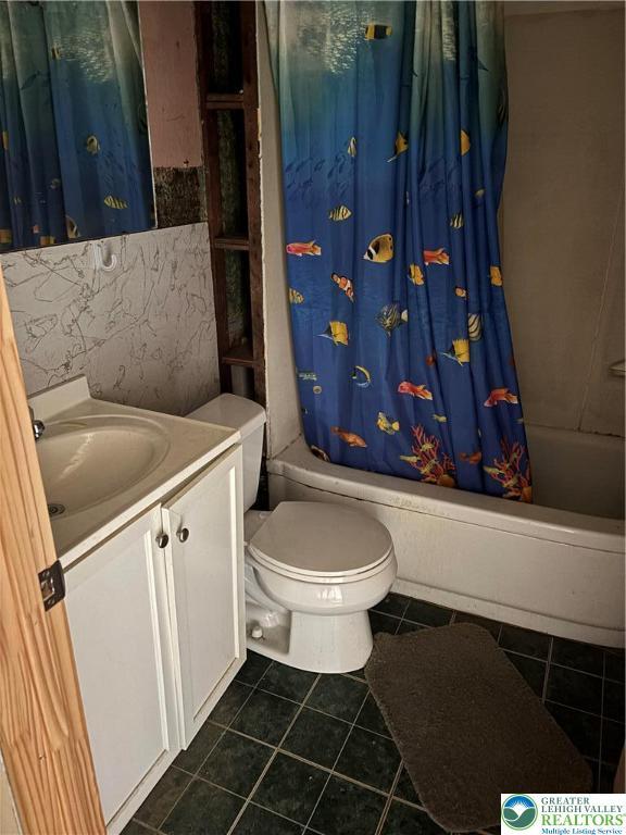 232 W Nesquehoning St, Easton, PA 18042 - bathroom featuring shower / bath combo with shower curtain, vanity, and tile patterned flooring