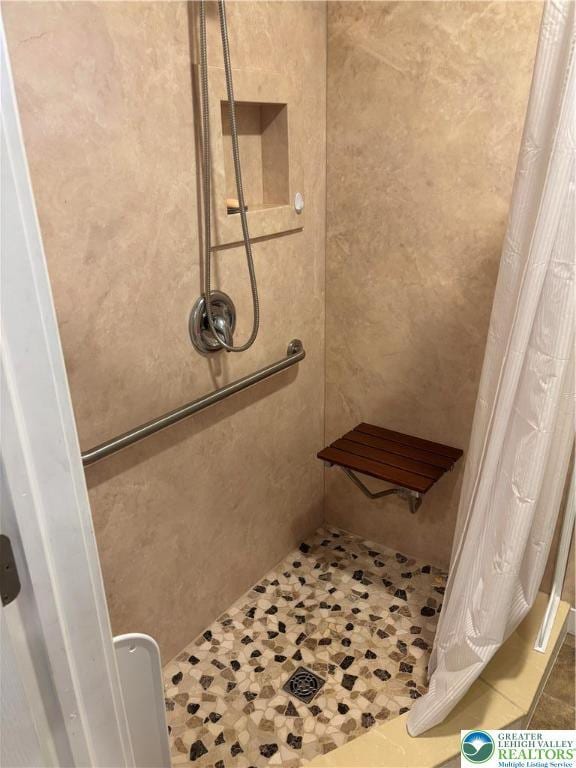 232 W Nesquehoning St, Easton, PA 18042 - bathroom with tiled shower and tile patterned floors