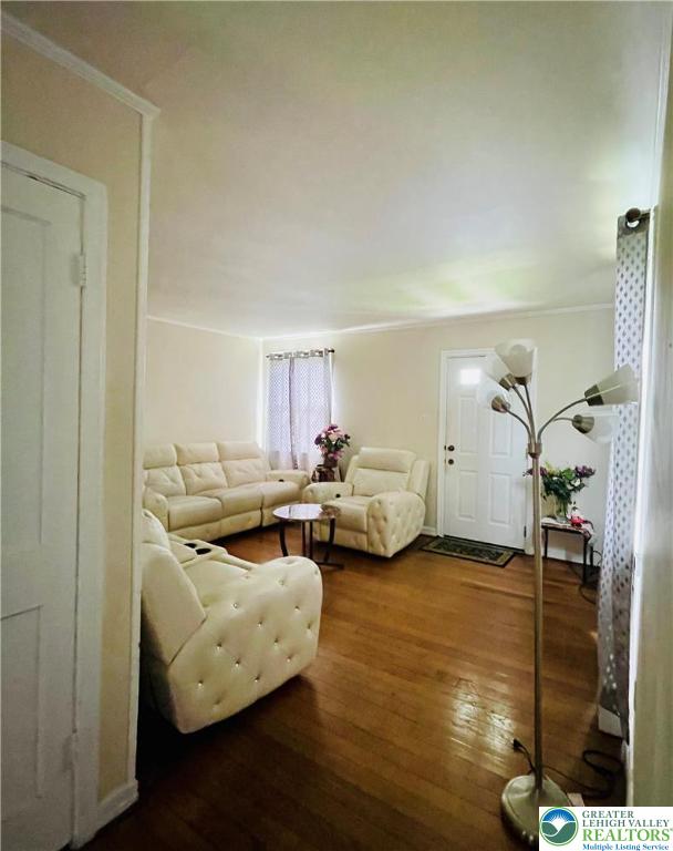 95 7th St, Whitehall Twp, PA 18052 - living room featuring hardwood / wood-style floors and crown molding