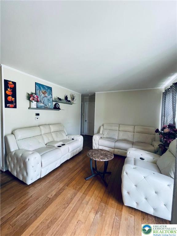 95 7th St, Whitehall Twp, PA 18052 - living area with hardwood / wood-style flooring and ornamental molding