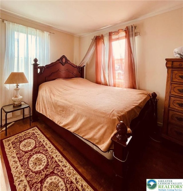 95 7th St, Whitehall Twp, PA 18052 - bedroom featuring multiple windows, crown molding, and wood finished floors