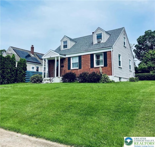 95 7th St, Whitehall Twp, PA 18052 - cape cod home with a front yard, brick siding, and roof with shingles