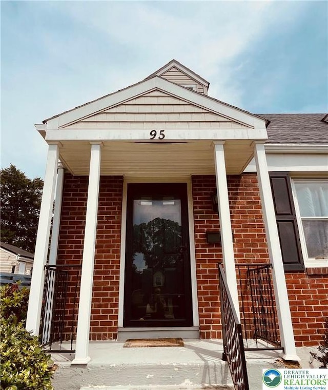 95 7th St, Whitehall Twp, PA 18052 - property entrance with brick siding and a porch