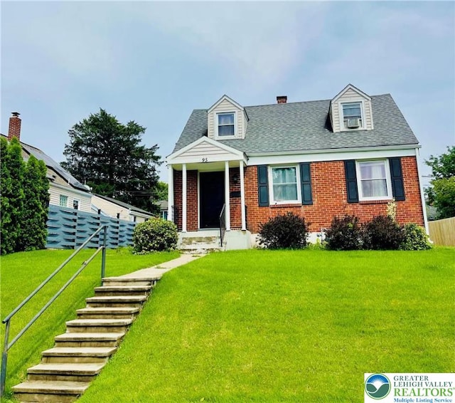 95 7th St, Whitehall Twp, PA 18052 - cape cod-style house with brick siding, roof with shingles, and a chimney