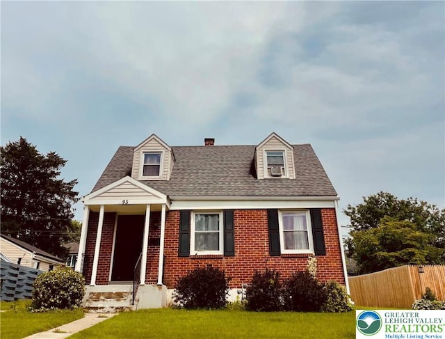 95 7th St, Whitehall Twp, PA 18052 - new england style home featuring brick siding, roof with shingles, and a chimney
