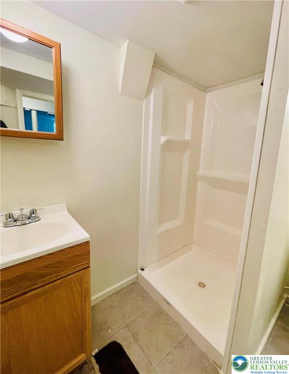 95 7th St, Whitehall Twp, PA 18052 - bathroom featuring vanity, a shower stall, and tile patterned floors