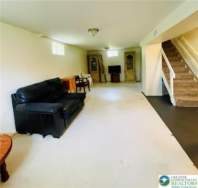 95 7th St, Whitehall Twp, PA 18052 - living room with stairway and finished concrete flooring