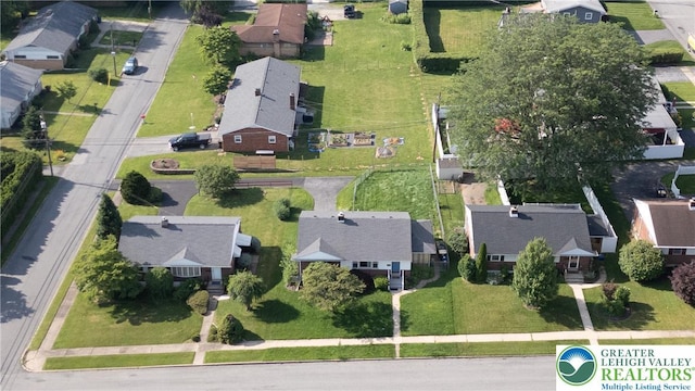 aerial view of property and surrounding area with nearby suburban area