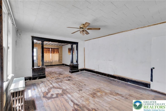 232 W Patterson St, Lansford Boro, PA 18232 - spare room with hardwood / wood-style flooring, a ceiling fan, and a wood stove