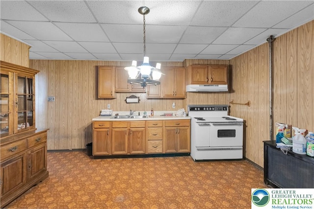 232 W Patterson St, Lansford Boro, PA 18232 - kitchen featuring electric range, under cabinet range hood, a drop ceiling, wooden walls, and decorative light fixtures