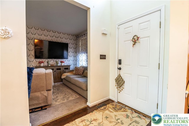 6 Westridge Ct, Middle Smithfield Twp, PA 18302 - entrance foyer featuring wallpapered walls, an accent wall, and wood finished floors